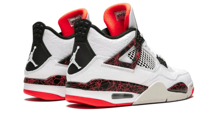 Air Jordan 4 Sneakers – White & Black with Red Crackle Accents